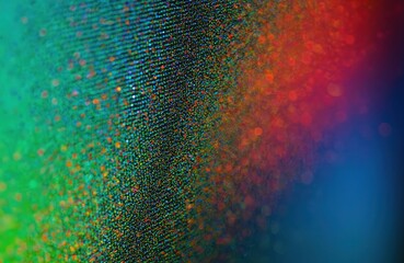 Macro photo of detailed colorful OLED monitor screen surface. Pixelated display with dot pattern. Modern tech abstract background design. LED panel, computer monitor, digital screen with color