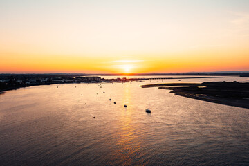 Serene seascape at Malahide with boats parked by the marina during a beautiful warm sunset