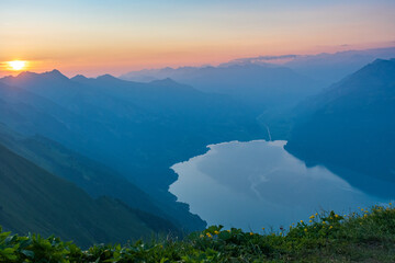 Sunrise on Augstmatthorn, painting the sky in gold above Brienzersee. A peaceful moment above the...