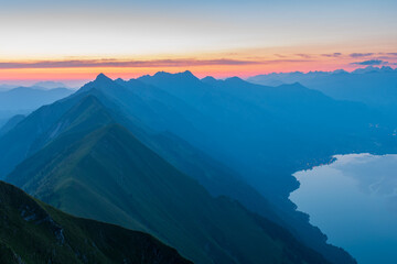 Sunrise on Augstmatthorn, painting the sky in gold above Brienzersee. A peaceful moment above the clouds, where silence meets breathtaking alpine beauty.