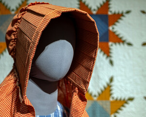 Replica of a bonnet worn by women during the settling of the America West