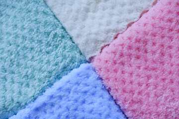 Background of colorful towels. Several soft terry towels.