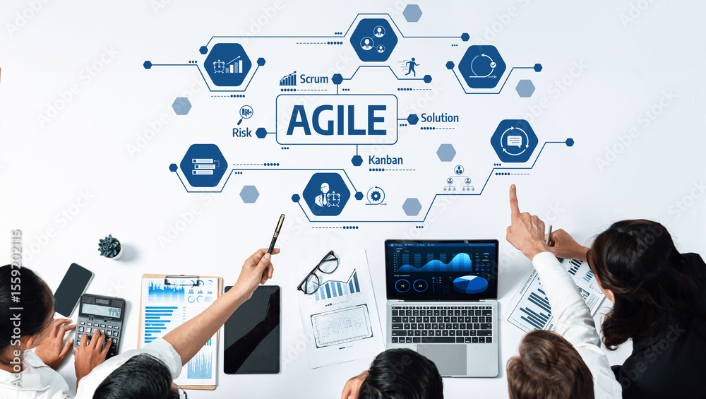 Poster A modern workspace depicting an agile team actively engaged in collaborative planning and analysis. Tools and visual aids enhance data-driven decision-making. Amity