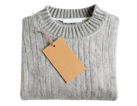 A folded gray wool sweater with a blank cardboard tag isolated on white
