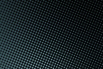 Dark slate grey dots on black background. Light is coming from bottom