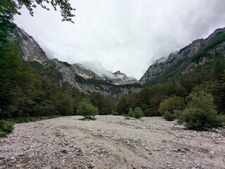 Logar valley in Slovenia with scenic mountains, wooden local huts, and traditional alpine farms.