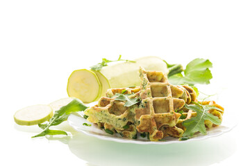 Crispy vegetable waffles served with herbs on white background