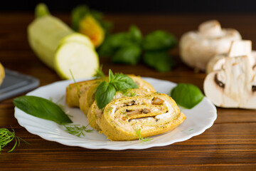 Zucchini roll with baked mushrooms and cheese