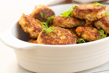 Homemade cutlets with a golden crust on a wooden table