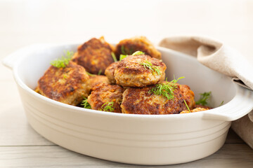 Homemade cutlets with a golden crust on a wooden table