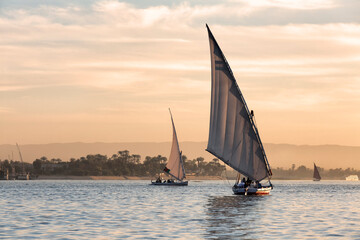 Tourists in a Felucca boat on the Nile River in Luxor Thebes - Egypt