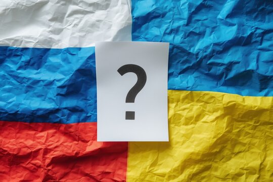 Question mark sits over Russia and Ukraine flags symbolizing uncertainty about the conflict and its future