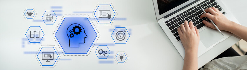 Head with gear and icons representing learning, digital training, and development process, showing...