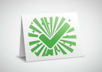 A striking image of a crisp white greeting card standing upright, prominently displaying a large, vibrant green checkmark icon. The checkmark is surrounded by dynamic radiating lines and sparkling sta