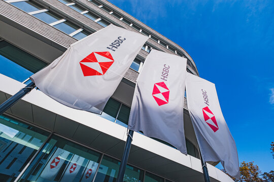 HSBC, British bank group's logo and lettering on the flags outside of the Dusseldorf branch office building