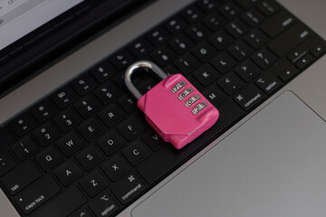 Personal data safety visualized with a colorful padlock on a laptop keyboard, cyber protection...