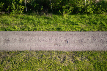 Top view of a stone path in a quiet green park