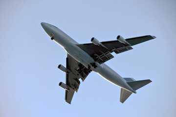 Large Passenger Airplane in Flight with Landing Gear Down