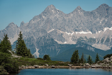 mountain lake (Spiegelsee) in the Austrian alps with Dachstein glacier in the background