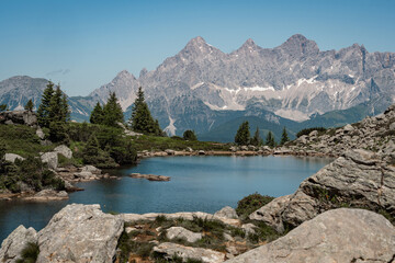 mountain lake (Spiegelsee) in the Austrian alps with Dachstein glacier in the background