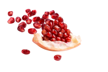 Healthy eating and antioxidant superfood concept with a fresh pomegranate slice and its ruby-red seeds.
