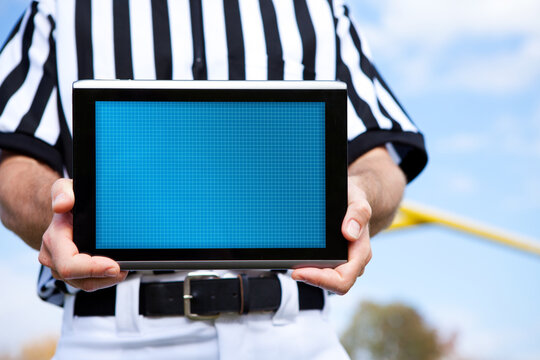 Referee: Holding a Blank Digital Tablet