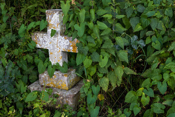 United Kingdom, Isle of Wight - 06.21.2025: Old gravestones in medieval overgrown and forgotten...