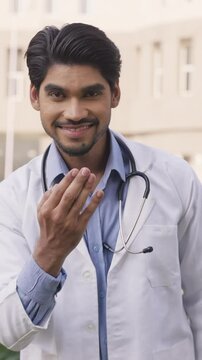 Vertical Shot of Indian Doctor Greeting Adab