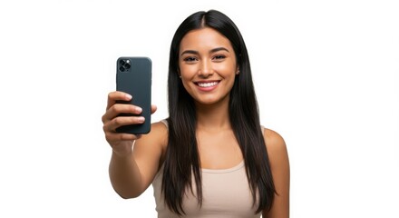 Naklejka premium Smiling young woman holding a smartphone taking a selfie isolated on white background