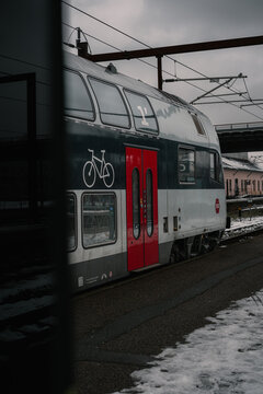 Naestved, Denmark, December 8th, 2023 - DSB IC4 train on urban station in winter scandinavia Denmark during delays on a snowy day.