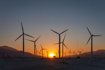 Scenic view of Palm Springs Windmills at Coachella Valley, California, USA at sunset against blue...
