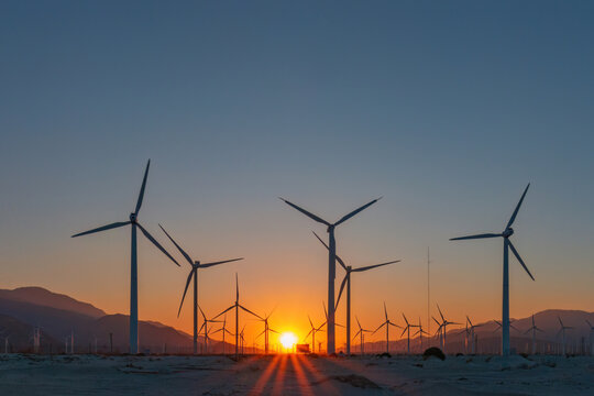 Scenic view of Palm Springs Windmills at Coachella Valley, California, USA at sunset against blue sky