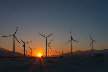Obraz premium Scenic view of Palm Springs Windmills at Coachella Valley, California, USA at sunset against blue sky