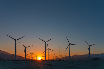 Scenic view of Palm Springs Windmills at Coachella Valley, California, USA at sunset against blue sky