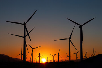 Scenic view of Palm Springs Windmills at Coachella Valley, California, USA at sunset against blue sky