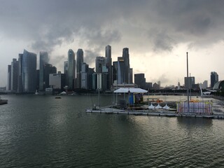Storm brewing over singapore skyline at sunset