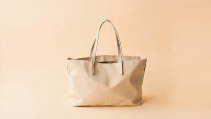 Neutral Shopping Bag. A light-colored, neutral-toned tote bag with handles is positioned in the center of the frame against a solid, warm-toned background. 