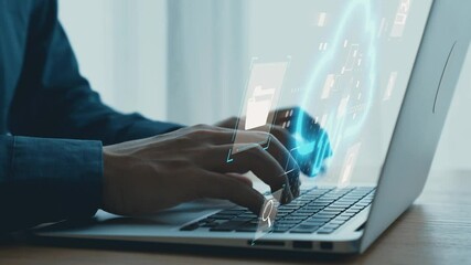 Professional man typing on laptop with digital technology interface illustrating cloud storage and data management concepts in modern workspace. Qubit. - Powered by Adobe