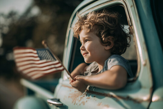 Young boy in a vintage truck, holding a US flag. A heartwarming glimpse of patriotism and youthful pride. American spirit, vintage Americana, summertime fun. Independence Day. Fourth of July.