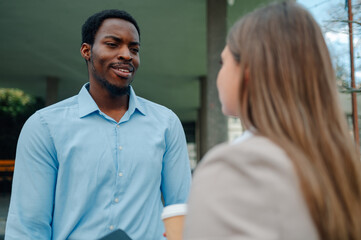 Business partners discussing a new project during a coffee break