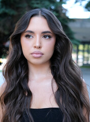 Obraz premium Beautiful young woman with healthy long hair on background. High quality photo