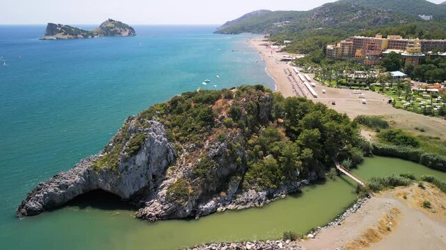Aerial view of beach, boats, island, resort, forest, mountains, Turkey.