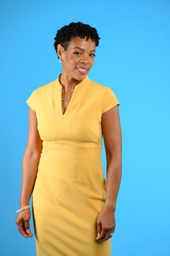 Confident Professional African-American Older Woman on Blue Background