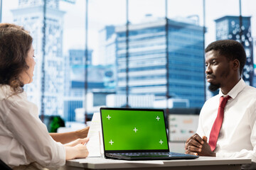 HR worker implementing diversity recruitment strategy for company, using green screen laptop....