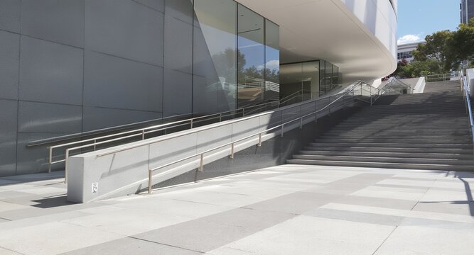 Modern building exterior with stairs and ramp accessible design