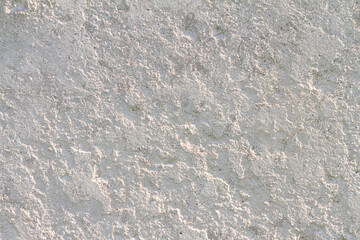 Abstract concrete background - in the form of a old rough scuffed wall, closeup