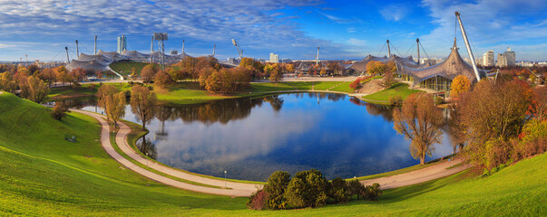 Naklejka premium Autumn cityscape, panorama, banner - view of the Olympiapark or Olympic Park and Olympic Lake in Munich, Bavaria, Germany
