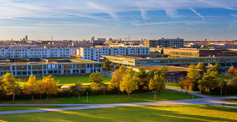 Autumn cityscape - view of the Munich district of Messestadt Riem with Riemer Park, Munich, Bavaria, Germany