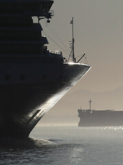 October 8. 2023, Vancouver, Canada_ zoomed-in view of a cruise ship bow at dusk with chrome-like...