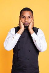 African american waiter recreates the three wise monkeys proverb, showing the symbolic metaphor by...